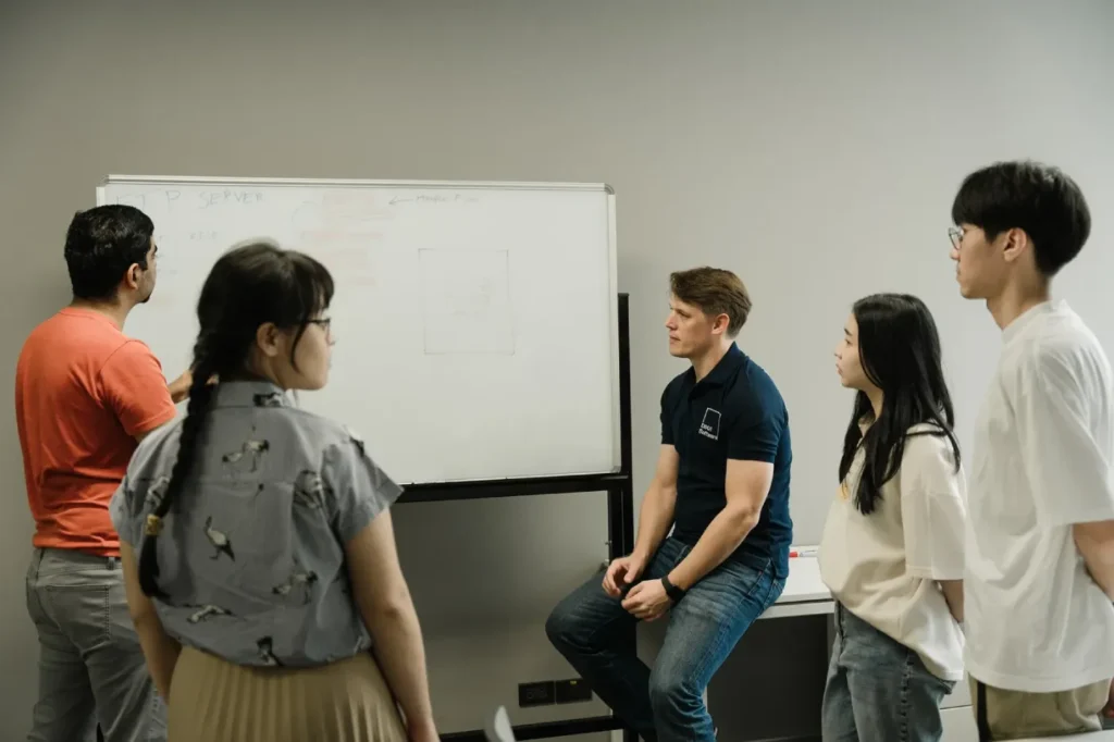 Internal discussion of DBot team members to find the best AI solution for a client project