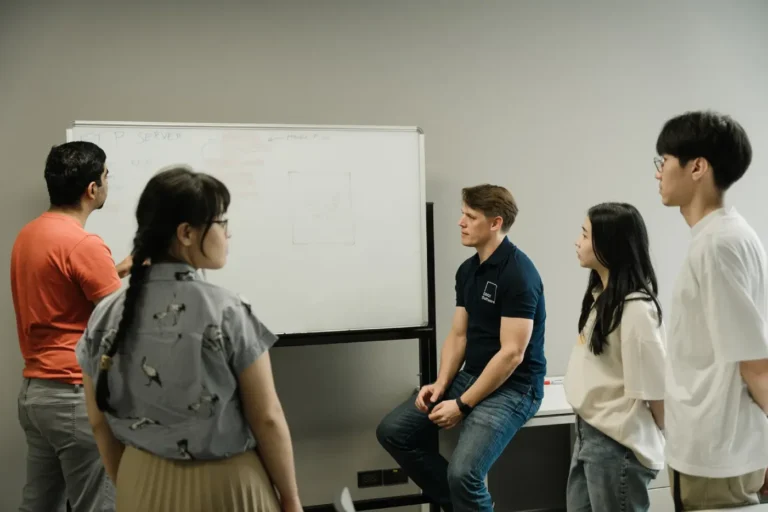 Internal discussion of DBot team members to find the best AI solution for a client project