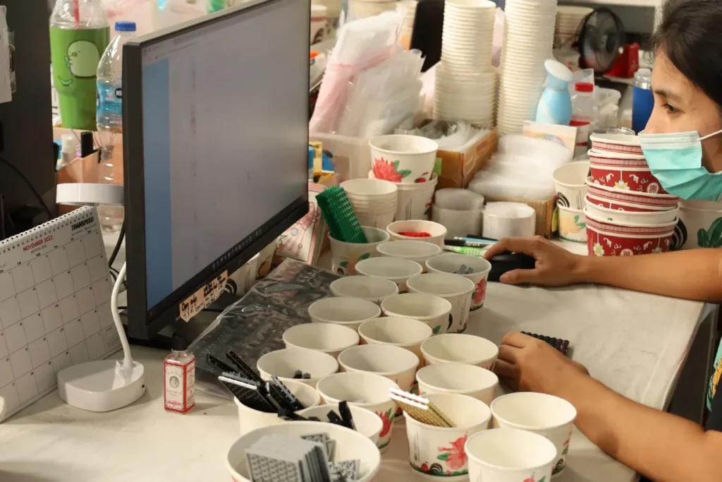 DD Bricks employee managing LEGO® inventory using a tech-powered stock management system